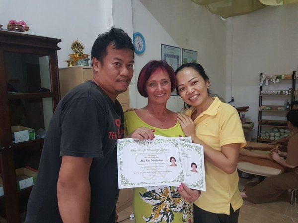 Rita receiving Thai massage certification in Thailand